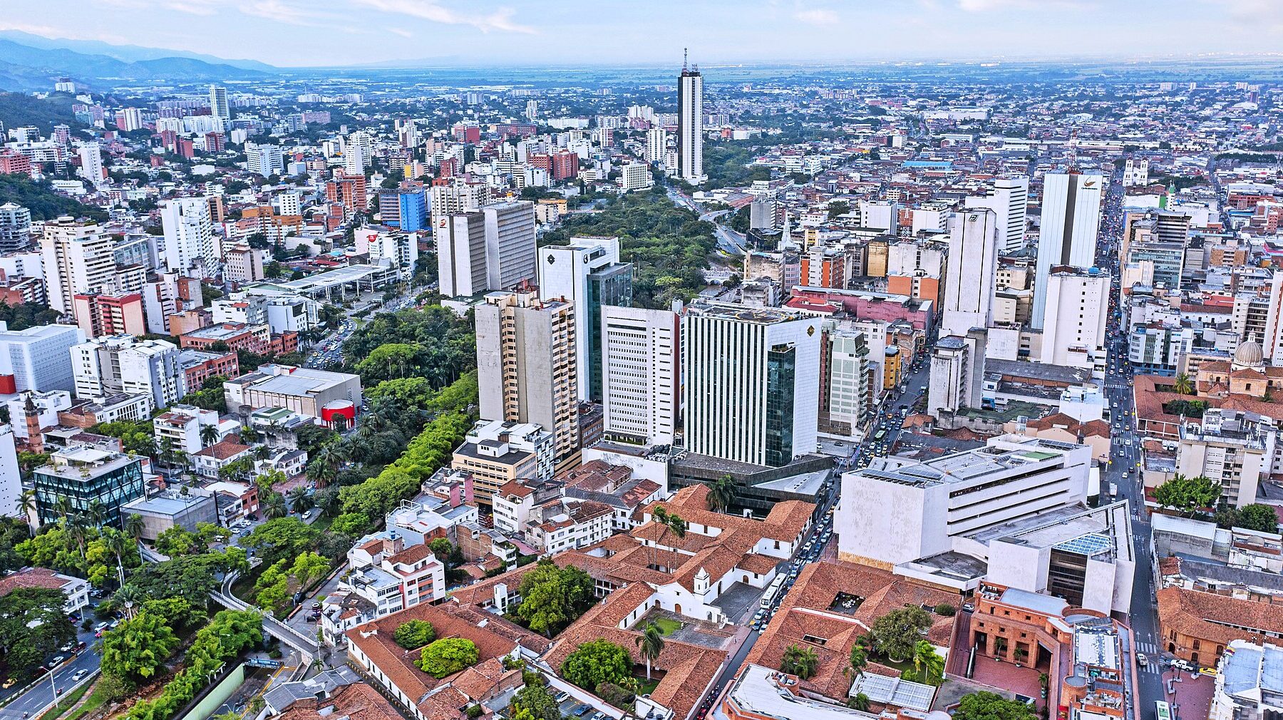 Aerial view of downtown Cali, Colombia, with its skyline and surrounding hills