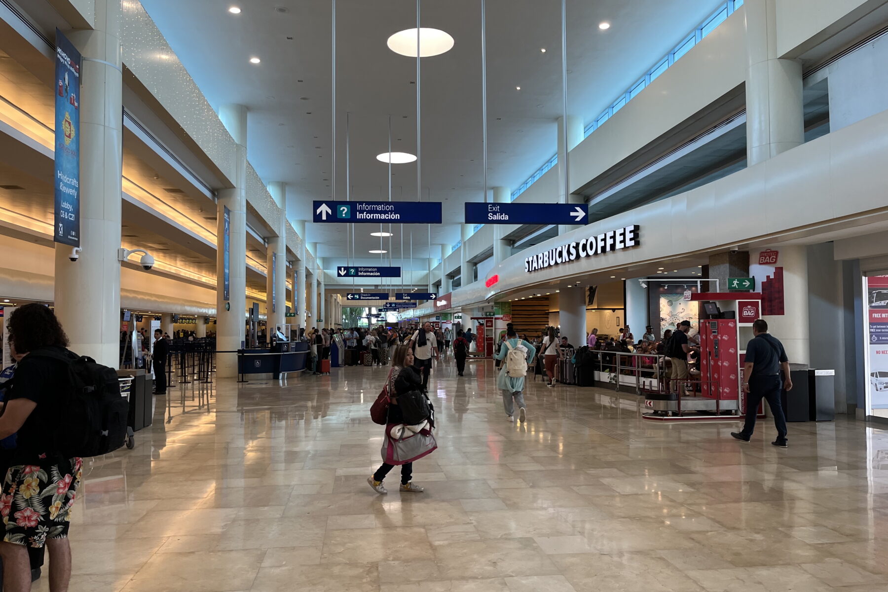 Passengers in a terminal at Cancun airport, part of Mexican airport traffic figures