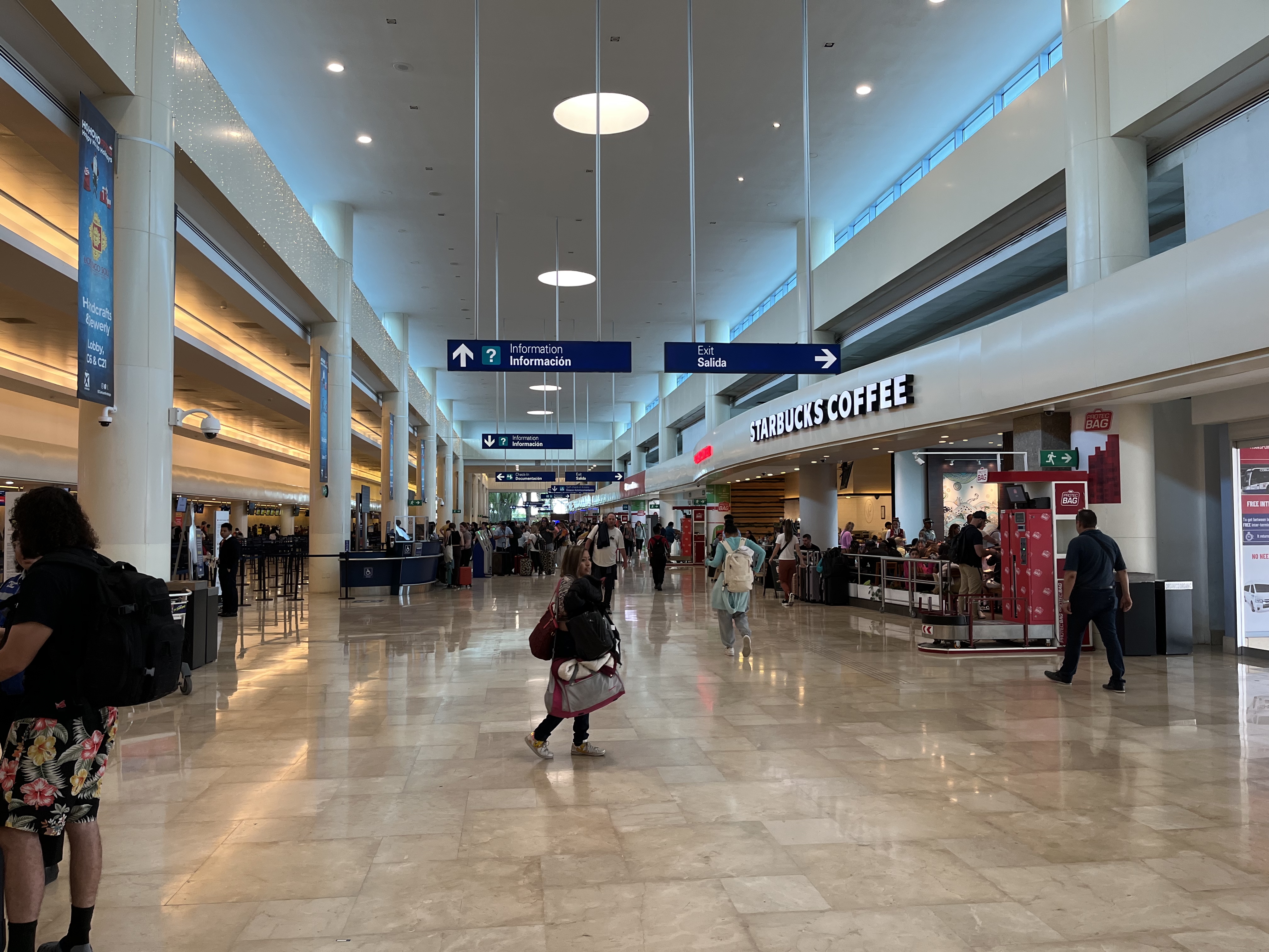 Passengers in a terminal at Cancún airport, part of Mexican airport traffic figures