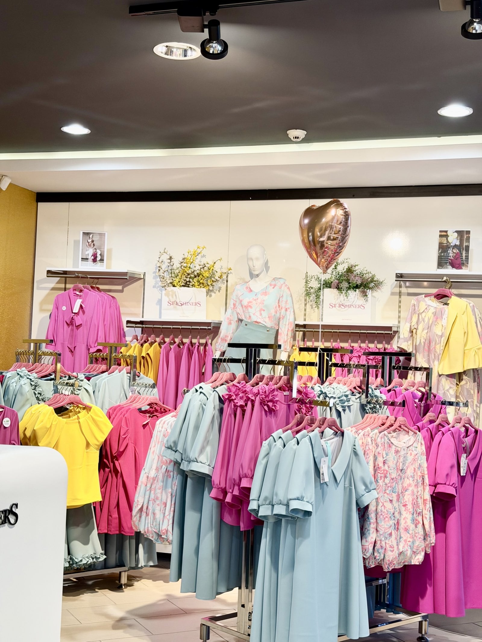 C&A second-quarter results report on a smartphone screen with store in background