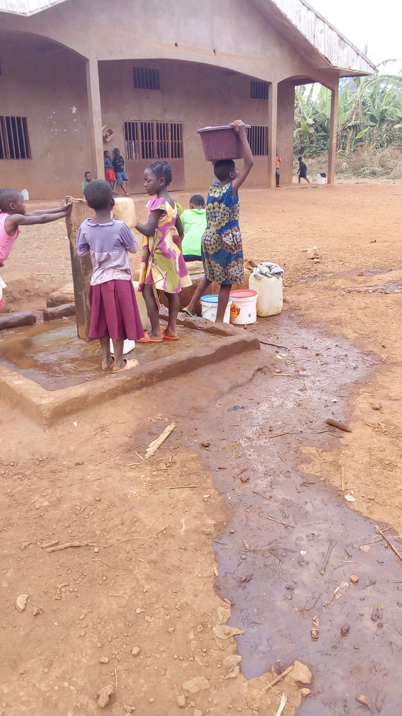Residents collecting water at a community source.
