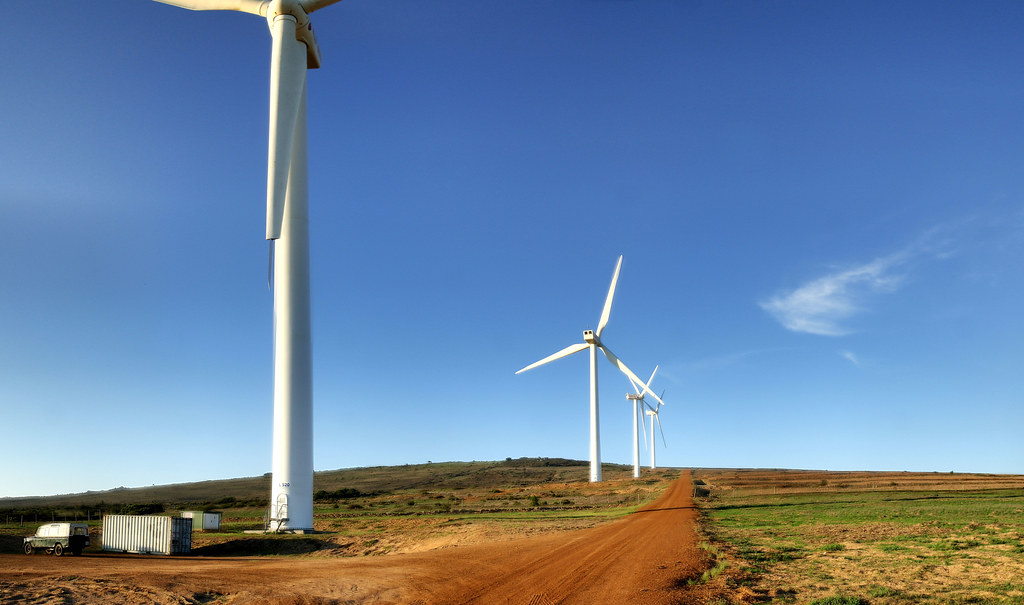 South Africa grid plan: high-voltage transmission towers carrying power lines across open country