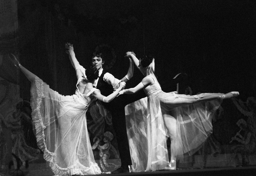 Ballet dancers perform a classical pas de deux.