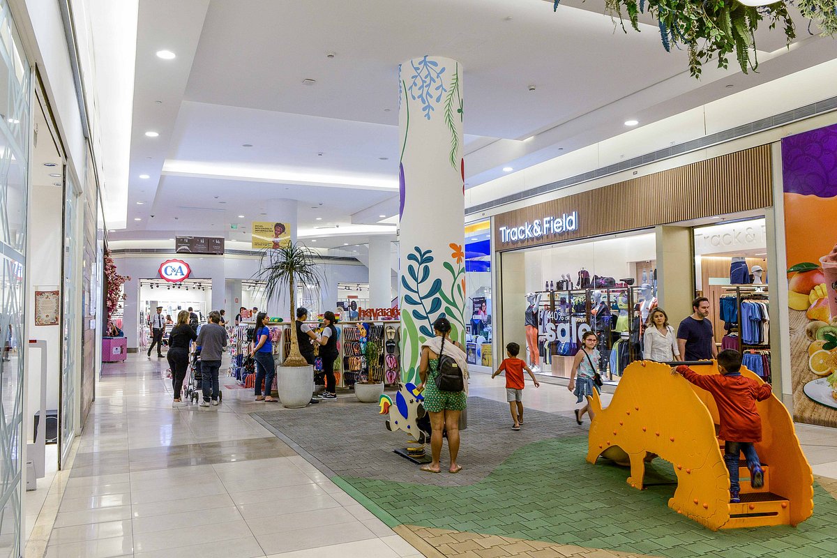 Allos - interior of a busy shopping mall with stores and shoppers