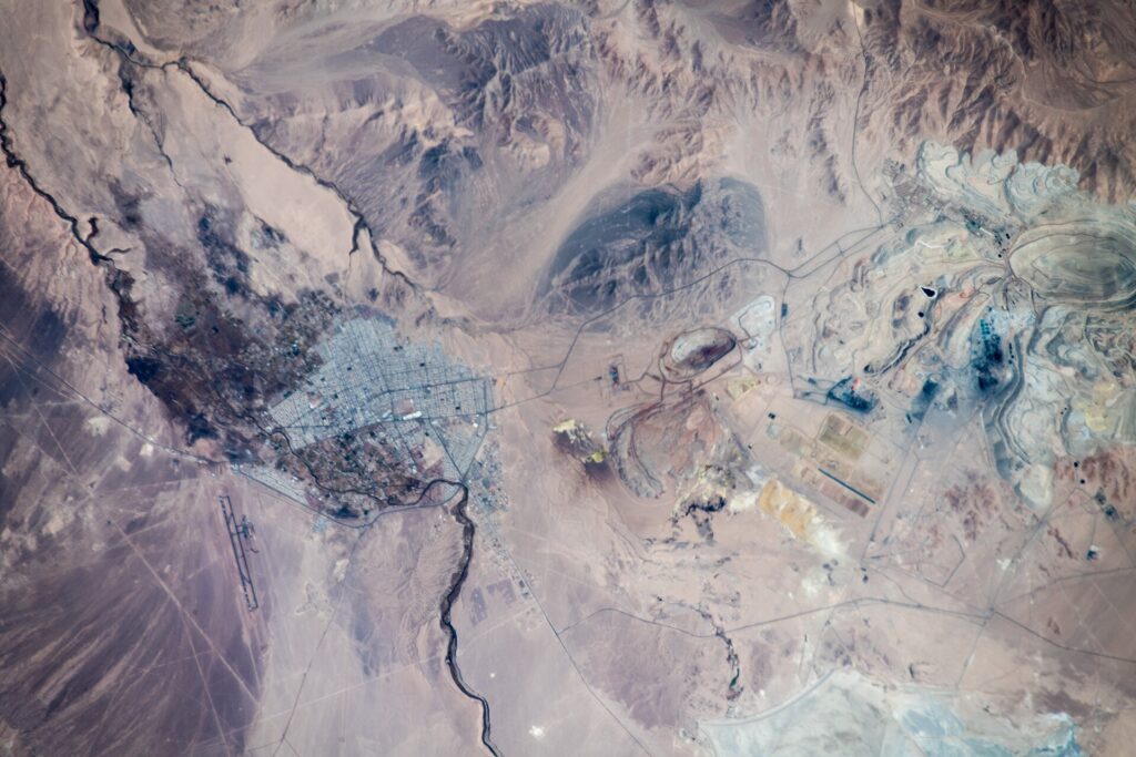 Aerial view of a city and large mining operations
