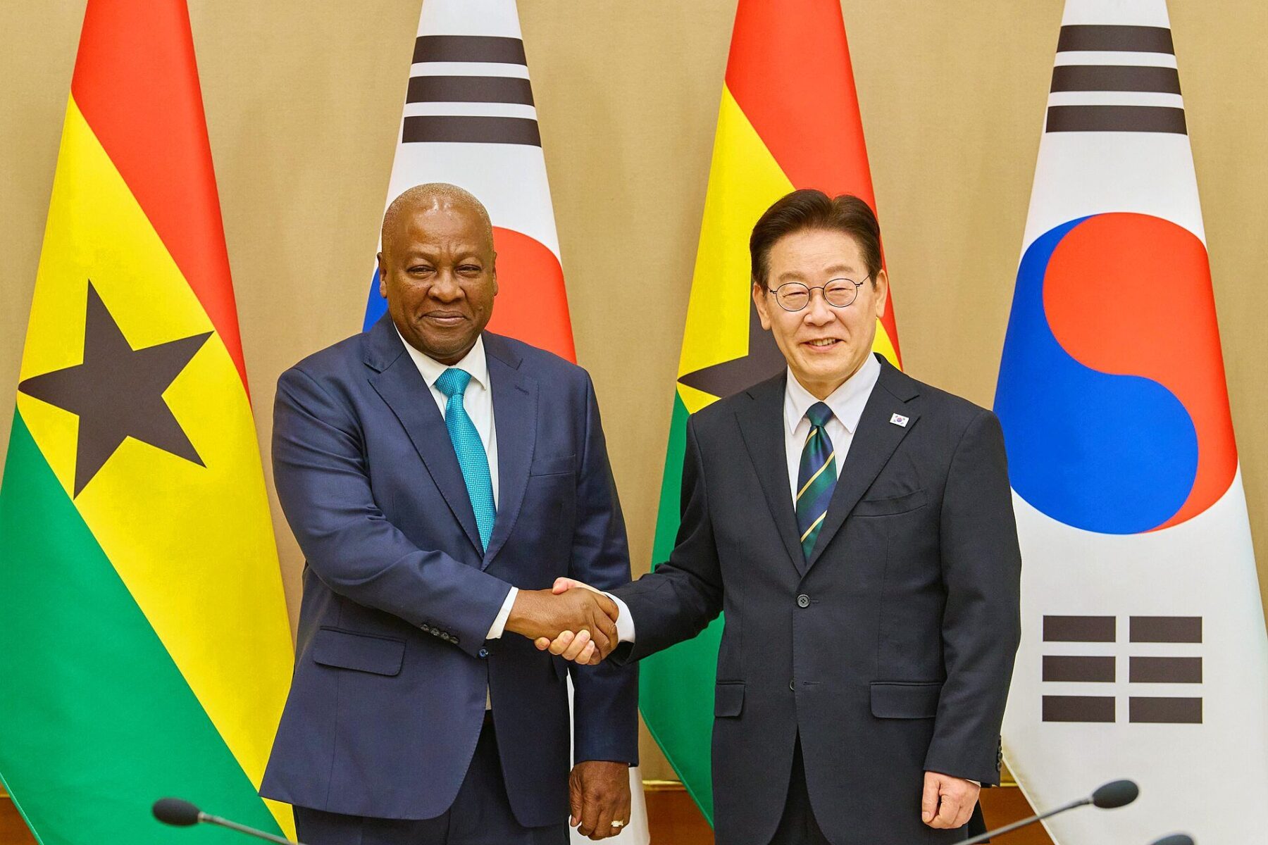 tax modernisation master plan - Ghana and South Korea leaders shake hands in front of both national flags at a bilateral summit
