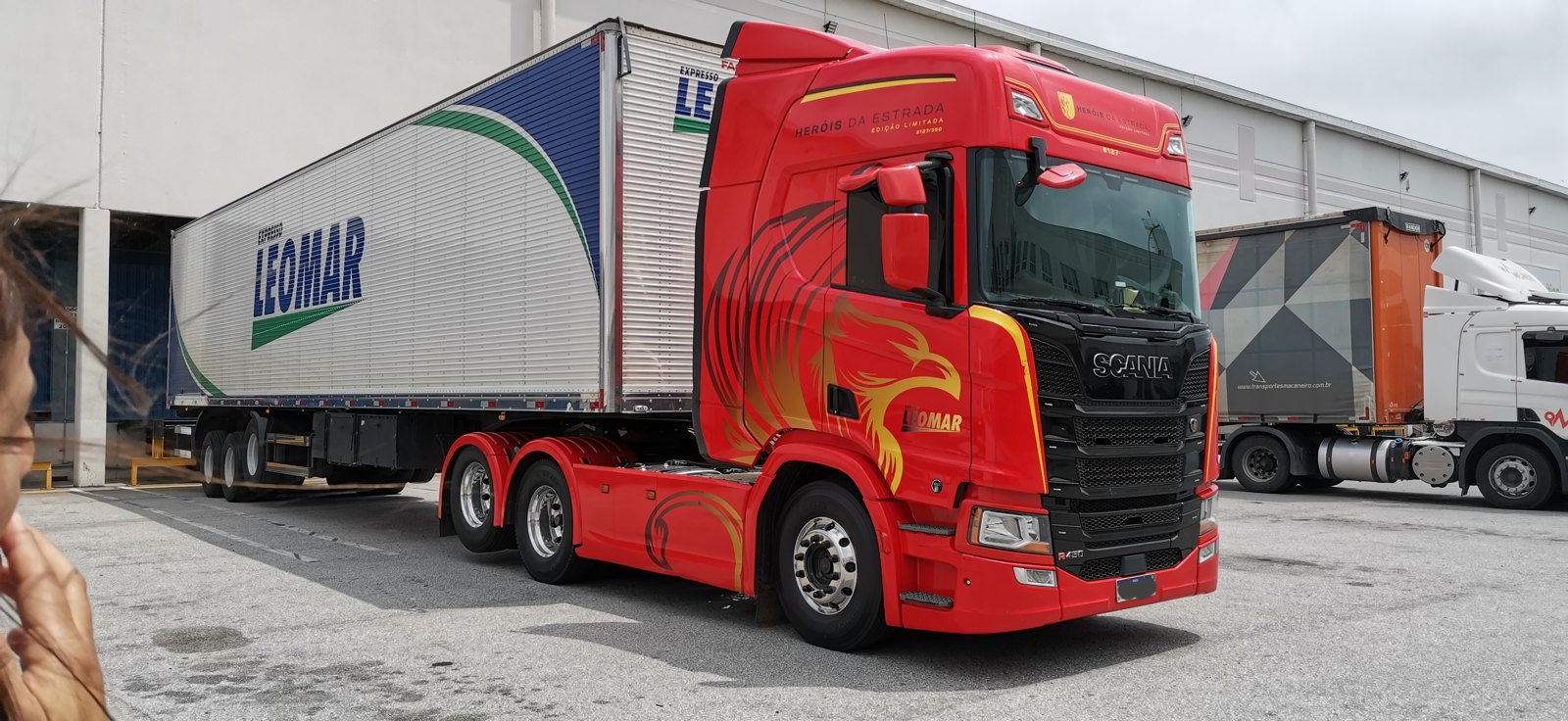 JSL second-quarter results — JSL trucks on a Brazilian highway carrying containers, highlighting the company's road freight logistics in Q2 2026