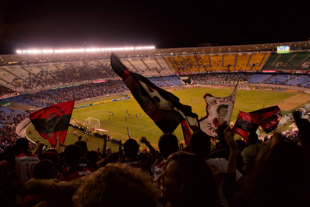 Fans with flags fill the Maracana stadium in Rio de Janeiro during a match, illustrating the Latin America sports daily