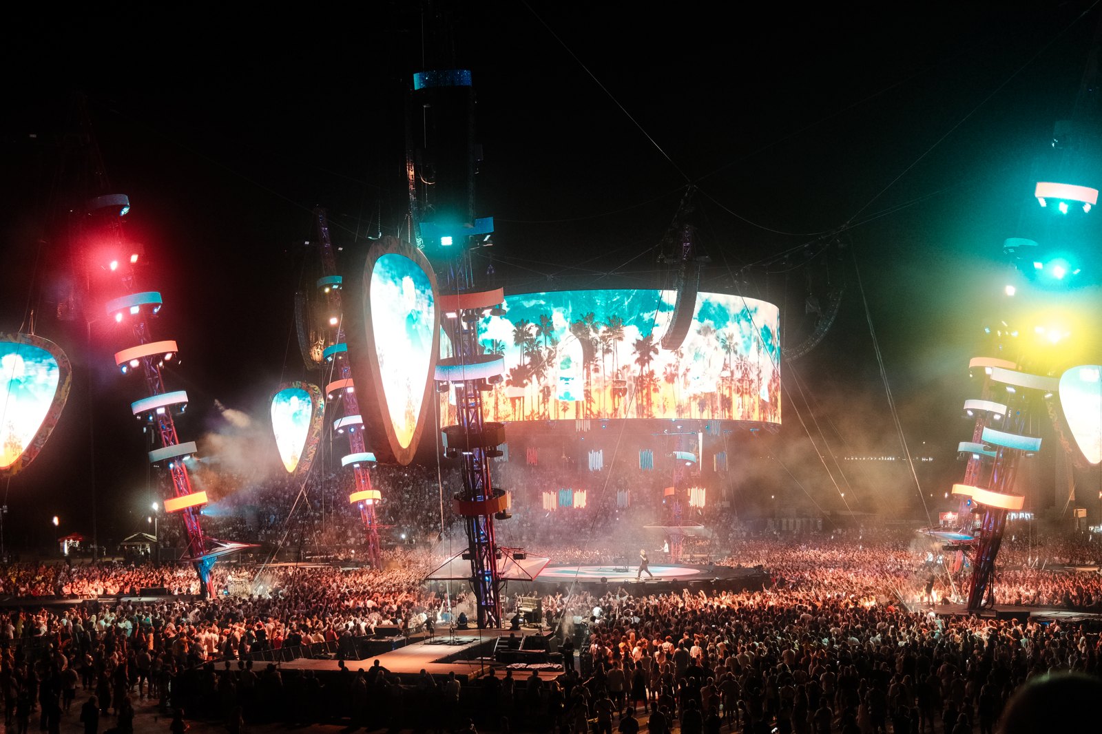 A large crowd at an outdoor concert.