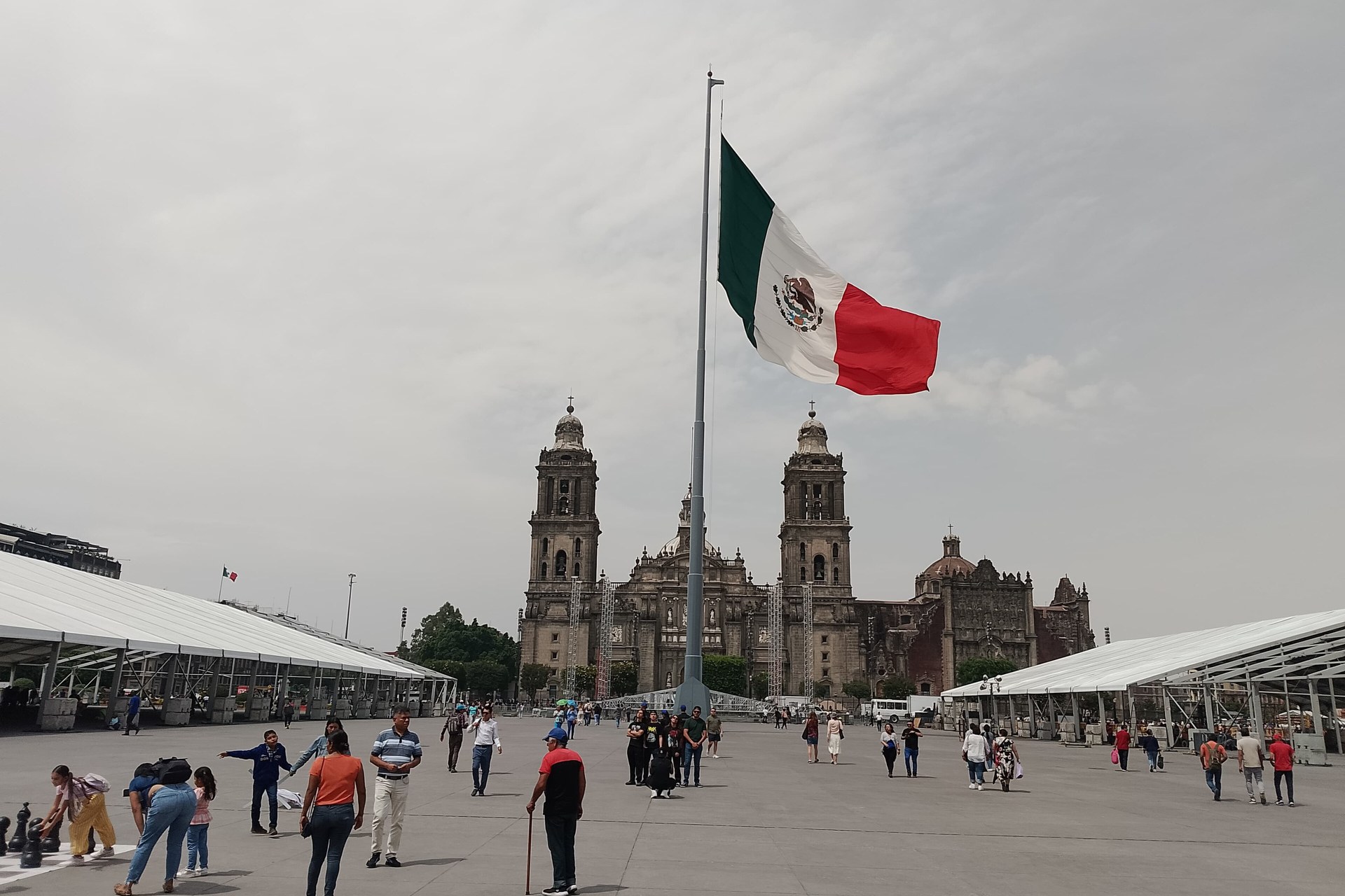 The Zocalo square in Mexico City with the national flag and Metropolitan Cathedral