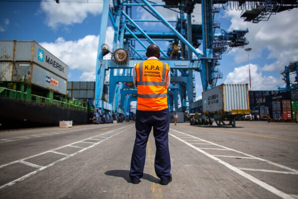 A Kenya Ports Authority worker seen from behind at the container terminal in Mombasa