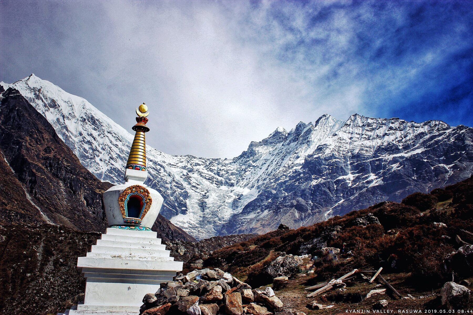 A stupa in the Kyanjin valley beneath the glacier faces of Rasuwa district, Nepal