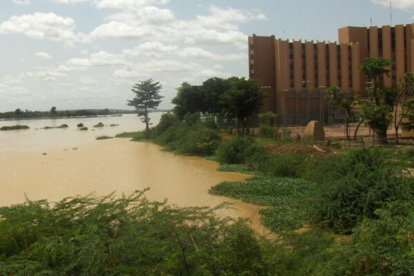 The Niger River at Niamey with a large public building on the bank