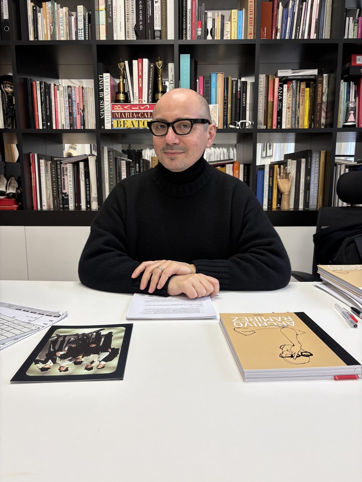 Pablo Ramirez with his book Archivo Ramirez in his Buenos Aires studio
