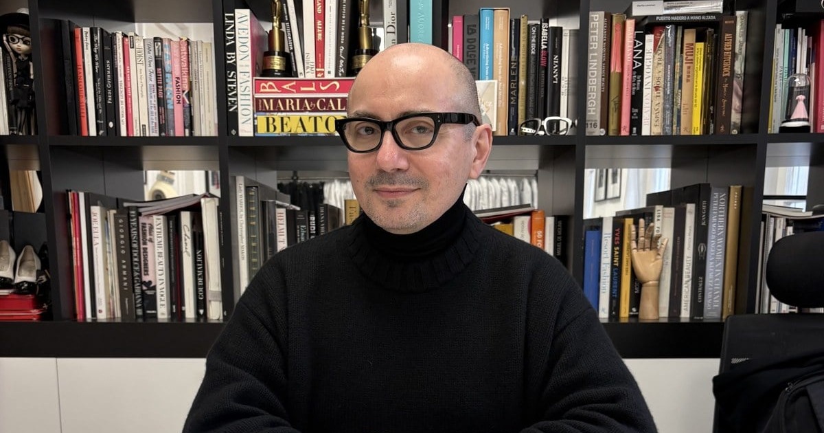 Pablo Ramirez in his Buenos Aires studio, in front of his fashion library