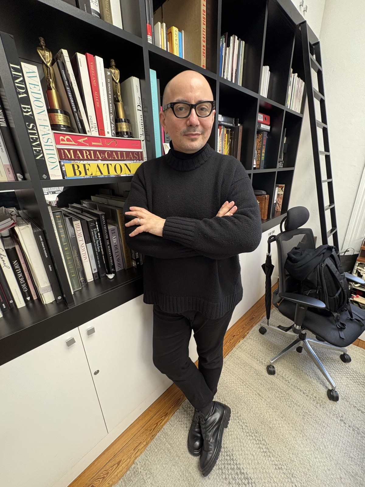 Pablo Ramirez in front of his fashion library