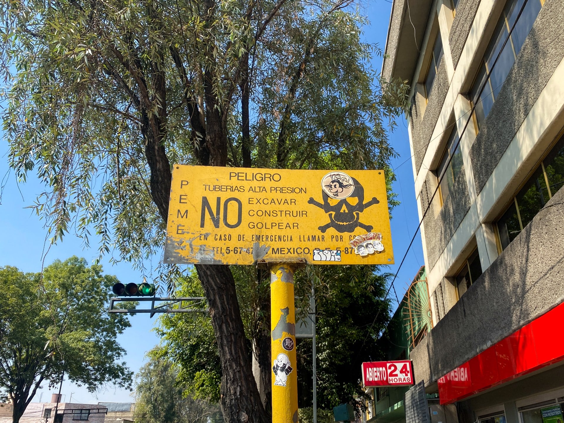Mexico fuel theft pact — Pemex high-pressure pipeline warning sign