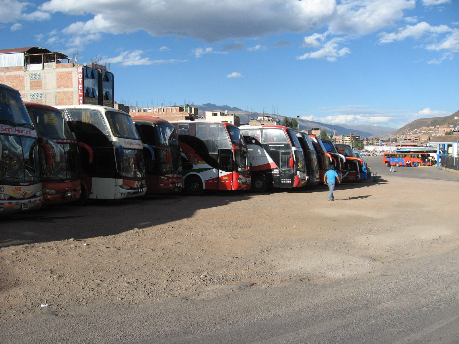 Interprovincial buses parked at a Peruvian terminal.