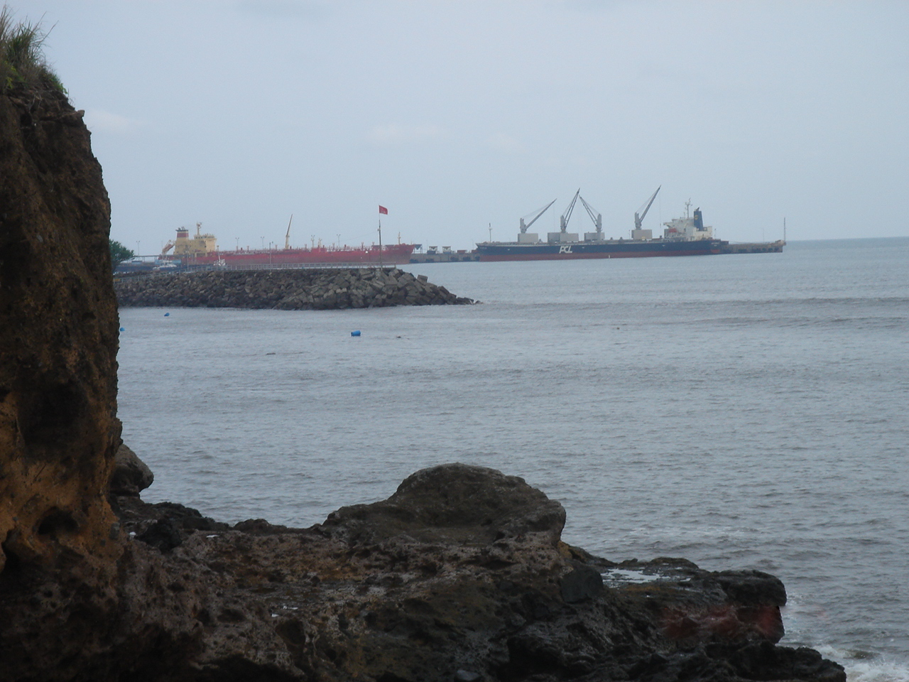 El Salvador growth forecast &mdash; cargo ships at the Port of Acajutla, whose expansion drives the construction boom