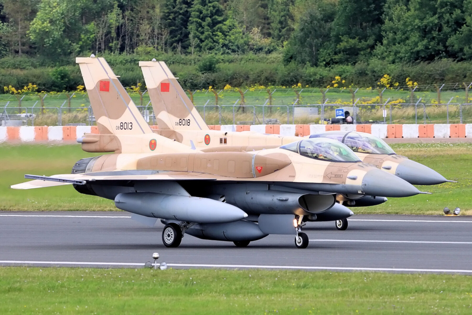 Two Royal Moroccan Air Force F-16 fighter jets on a runway