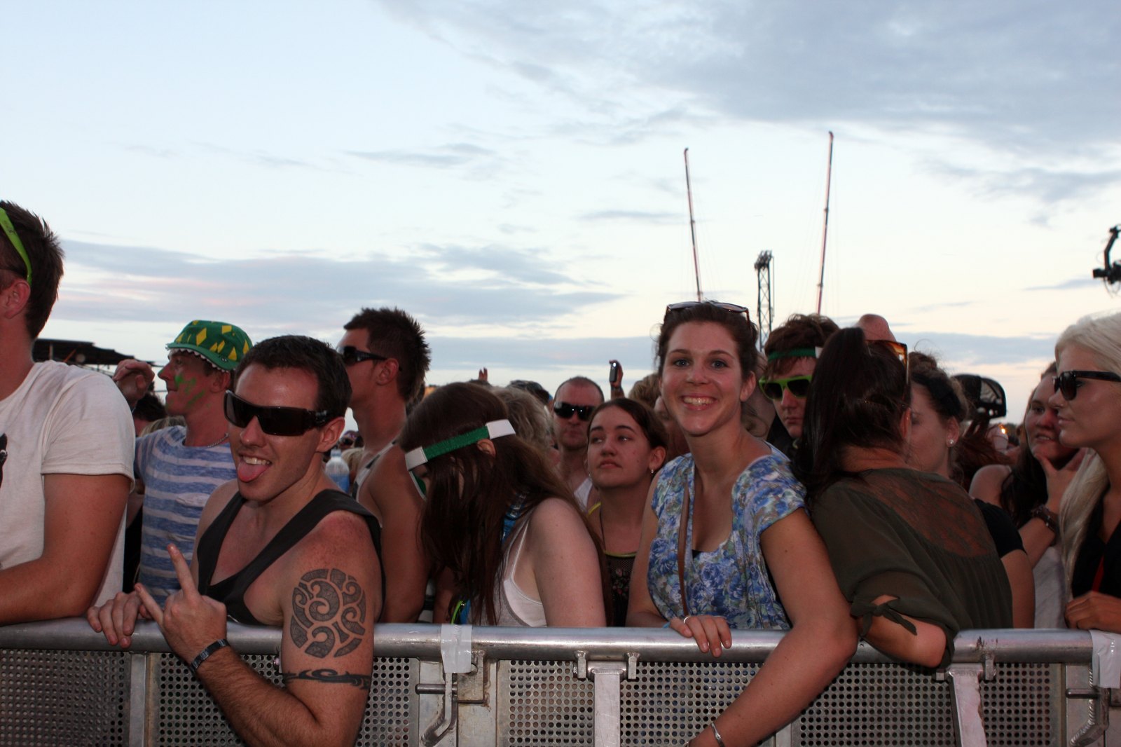 Fans at a large outdoor music festival.