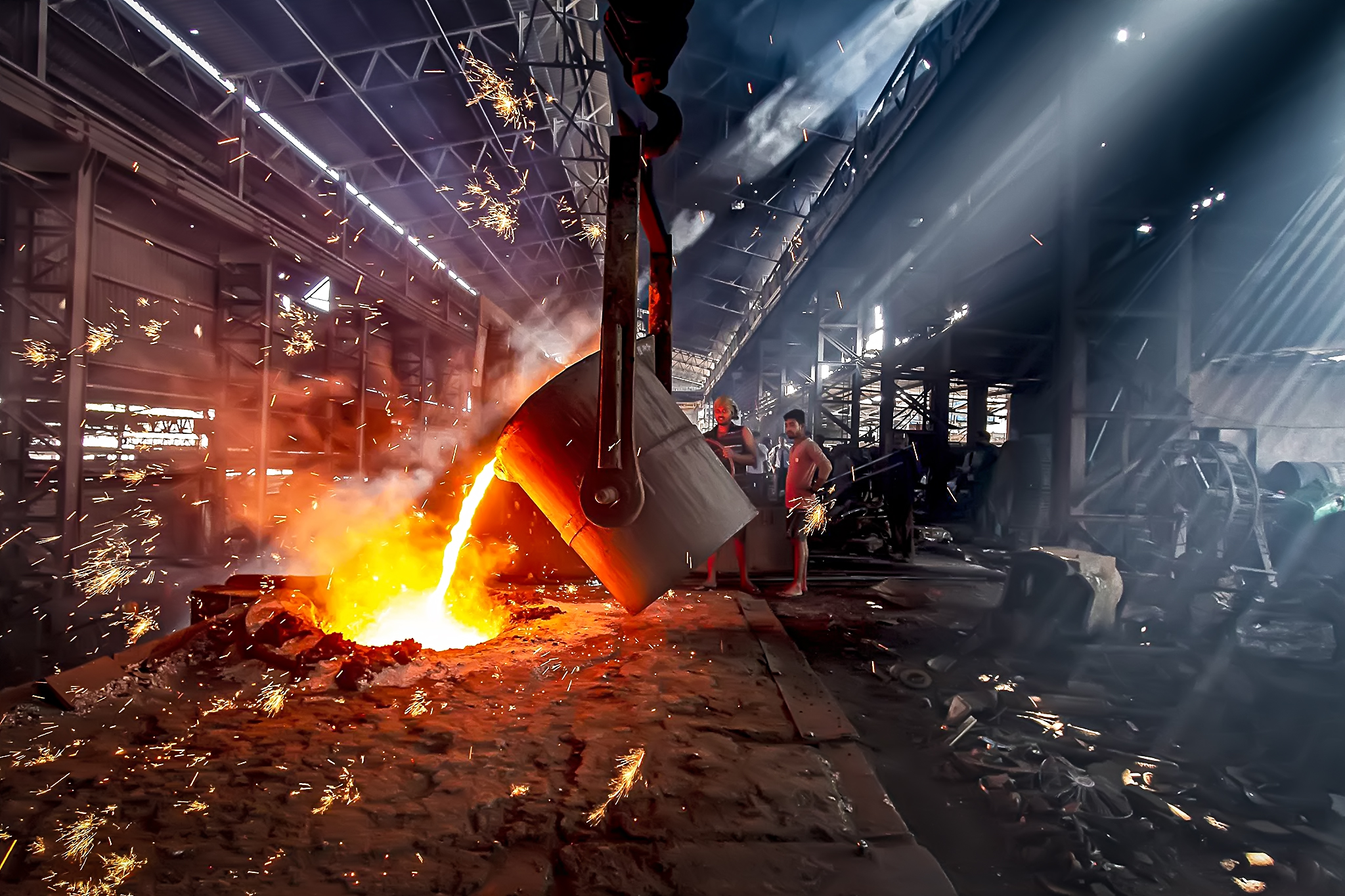 Molten metal pouring at a metallurgical furnace