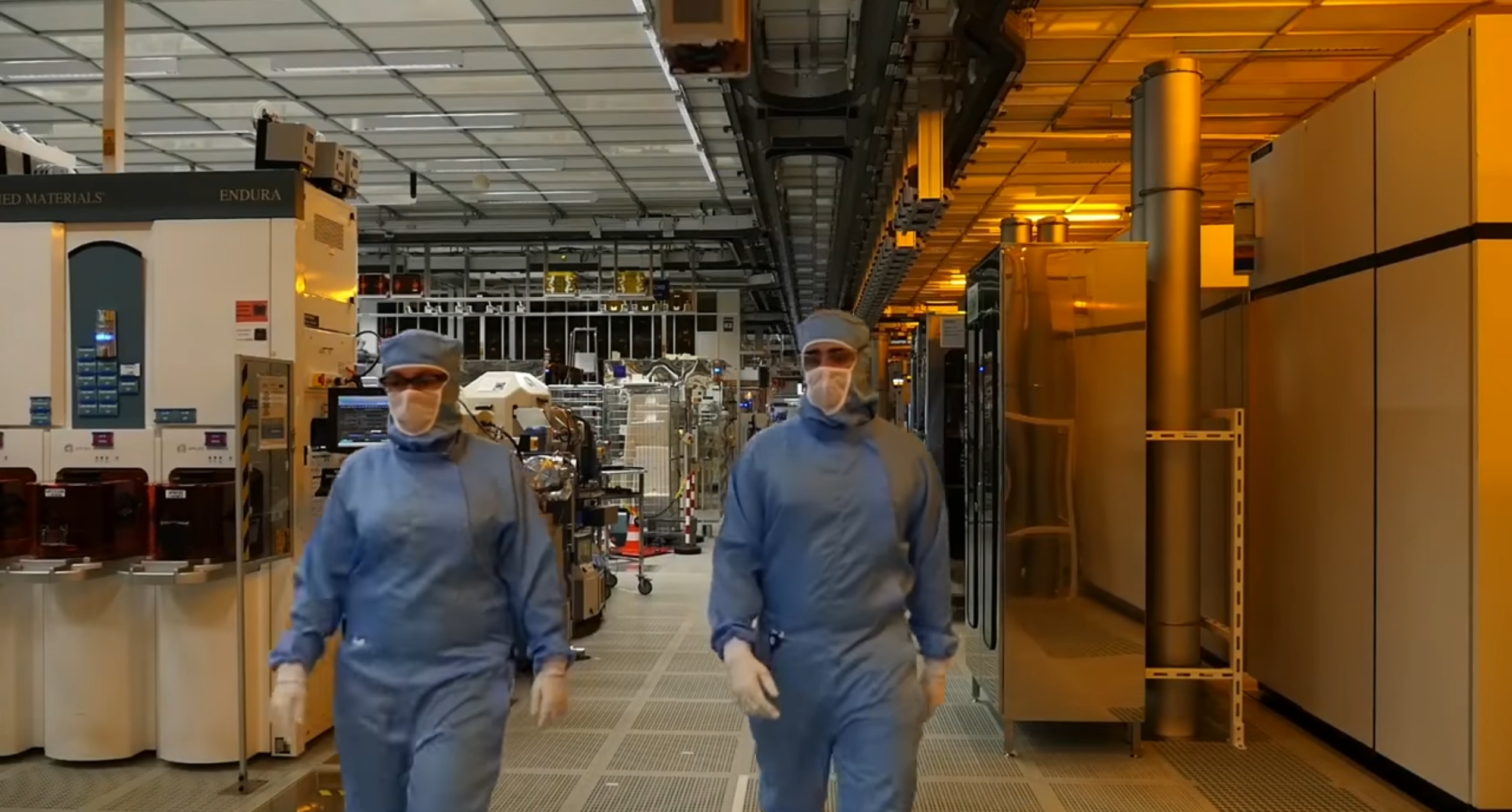 Workers in a semiconductor cleanroom