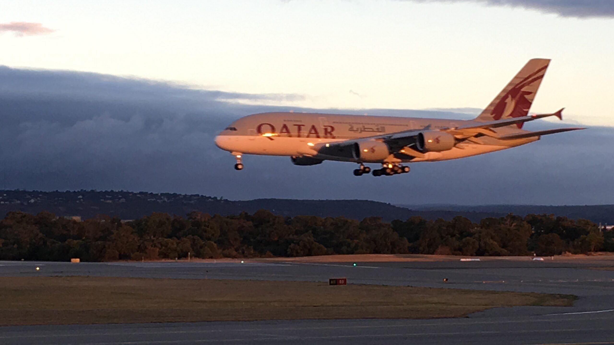 An airliner landing on an airport runway