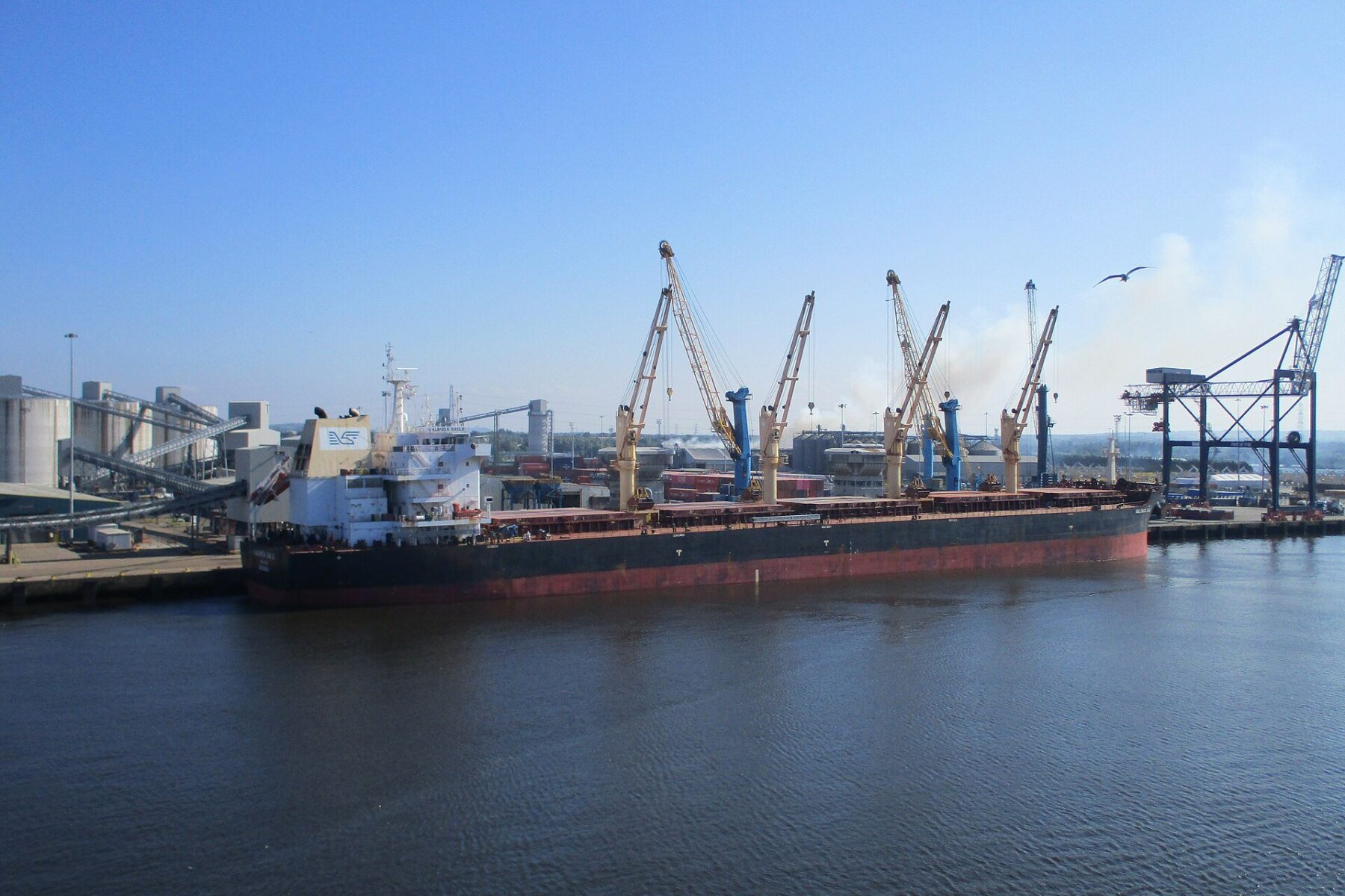 Porto Sudeste - a bulk carrier loading iron ore at a port jetty