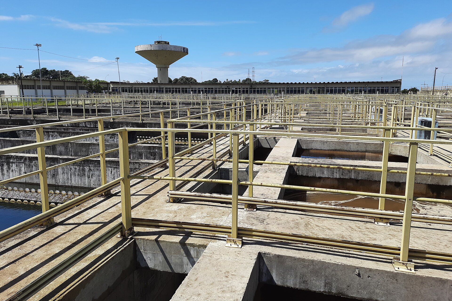 Sabesp water context - a large water treatment plant with open-air settling tanks in Brazil