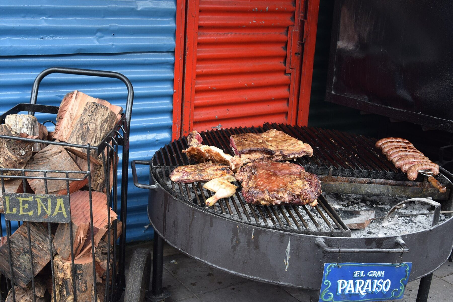 Argentina beef consumption - beef cuts, chicken and sausages on an asado grill