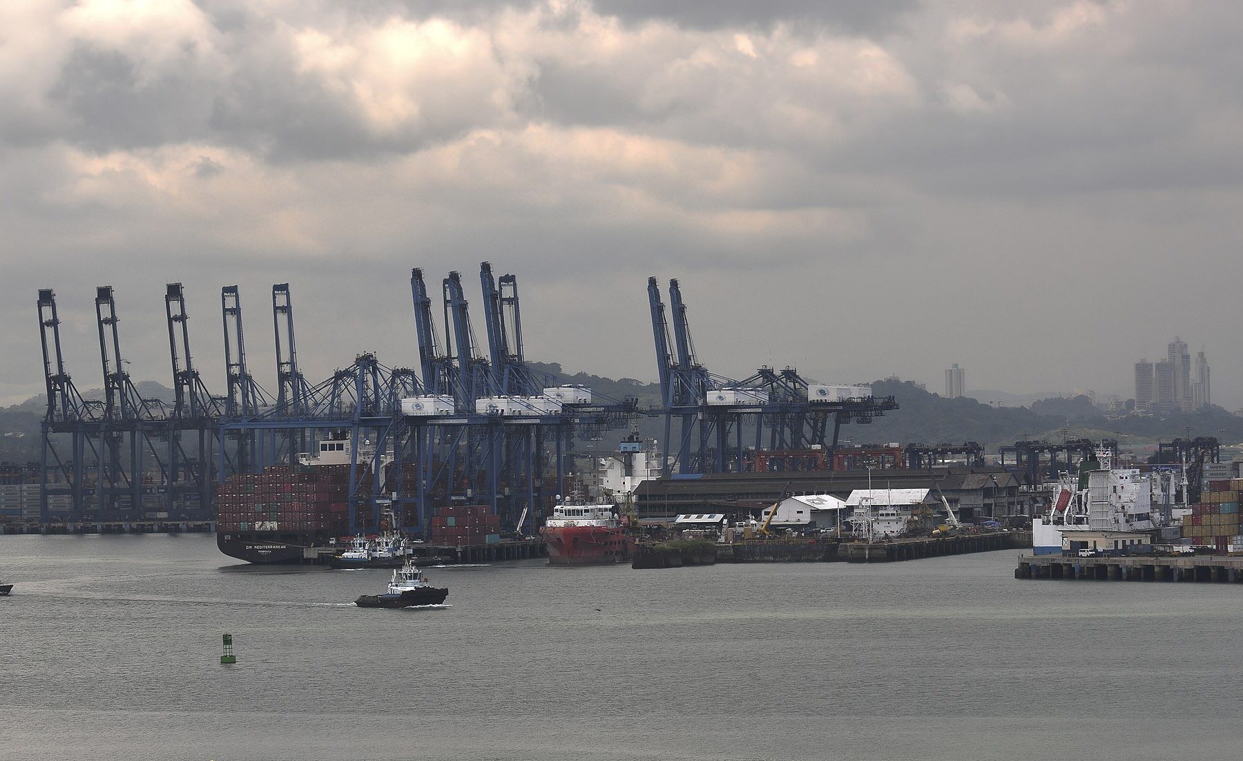 CK Hutchison - container cranes and cargo ships at the Port of Balboa in Panama