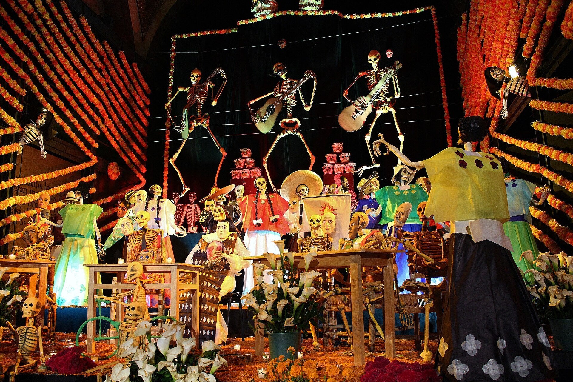 Coco 2 - a Dia de Muertos ofrenda altar decorated with marigolds, candles and photographs in Mexico