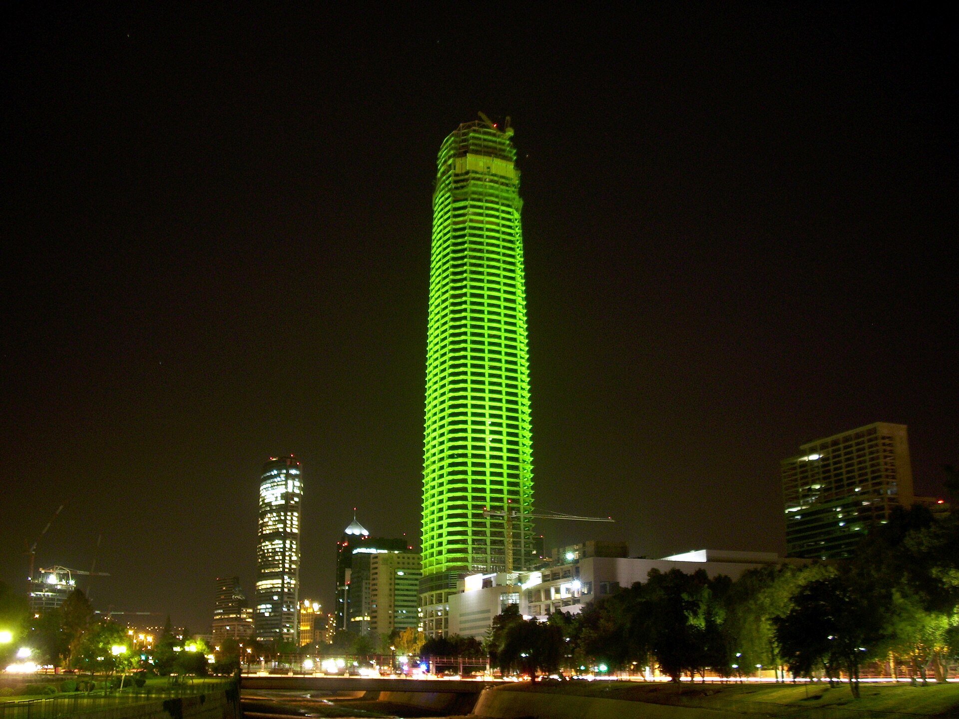 Santiago's financial-district skyline at night, the backdrop to Chile tax reform news that gives new-home buyers a value-added tax break.