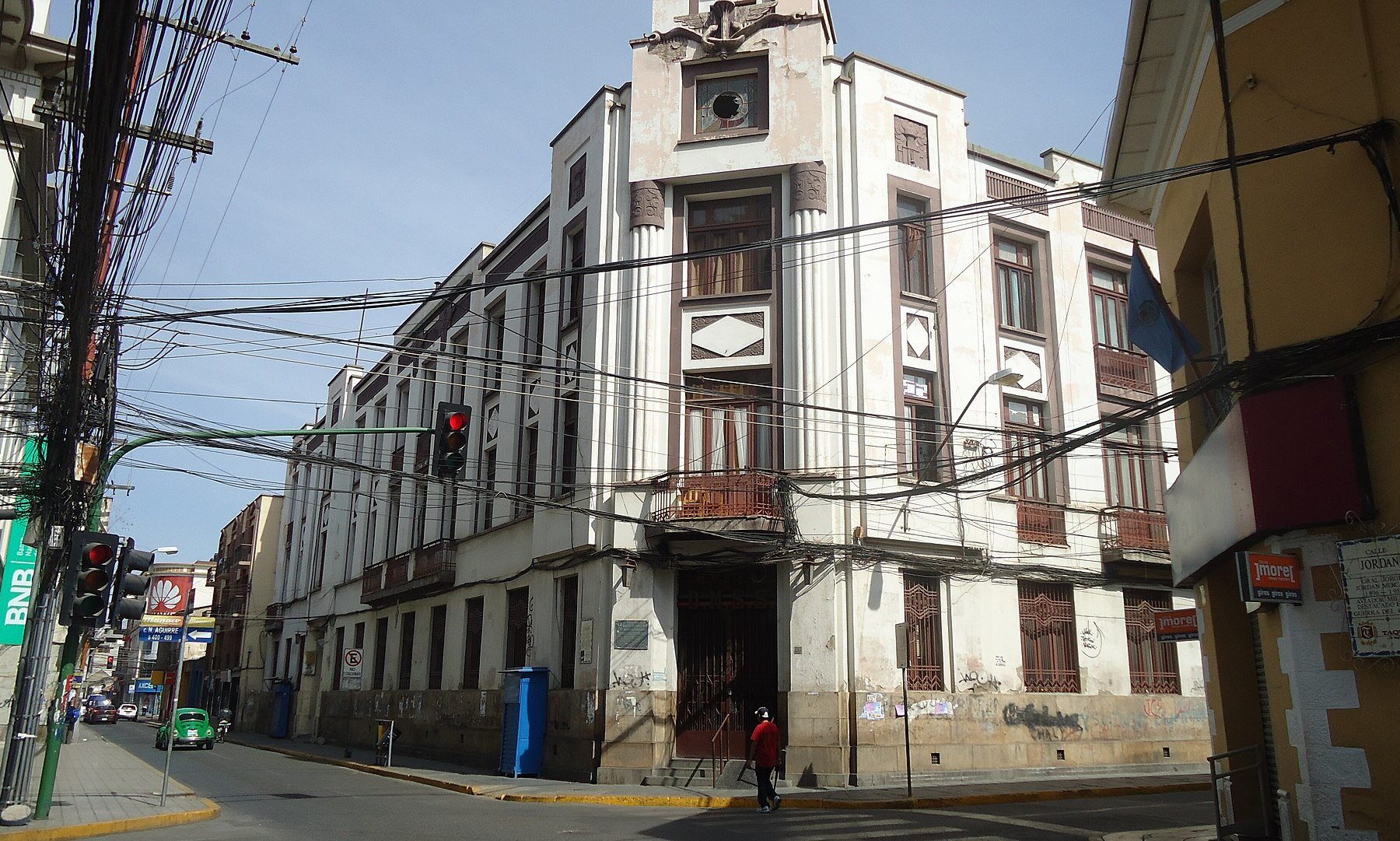 Bolivia dollar withdrawals: a former Banco Central de Bolivia building and a commercial bank branch on a street corner