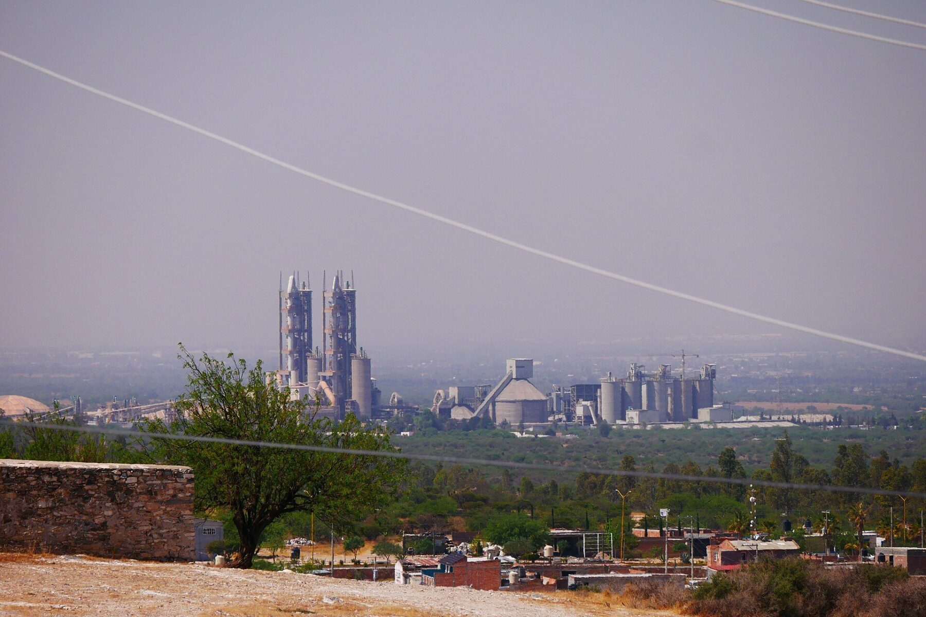 Cruz Azul cement plant towers seen across a valley in Aguascalientes, Mexico