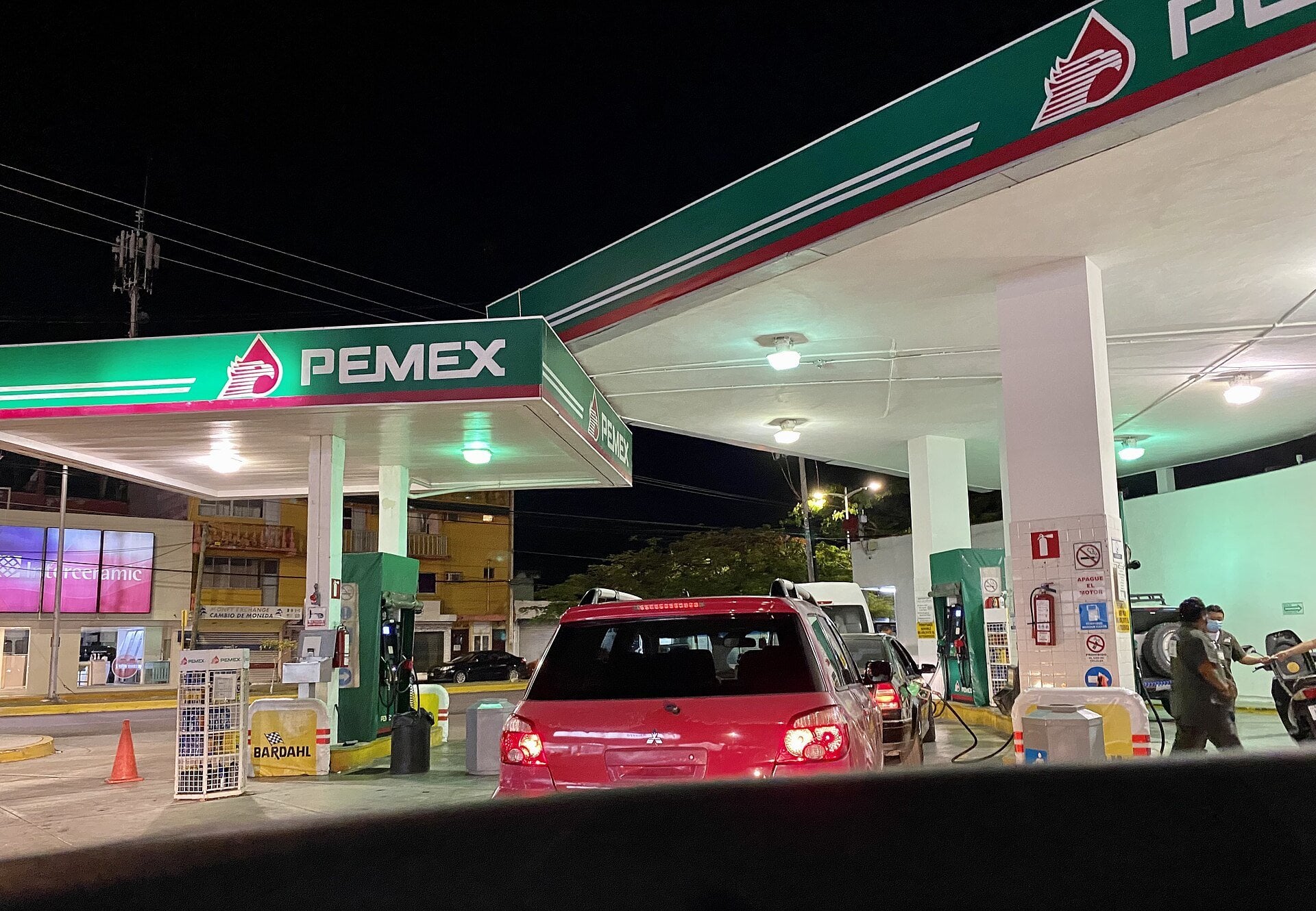 Mexico fuel - a Pemex gas station lit up at night in Cozumel
