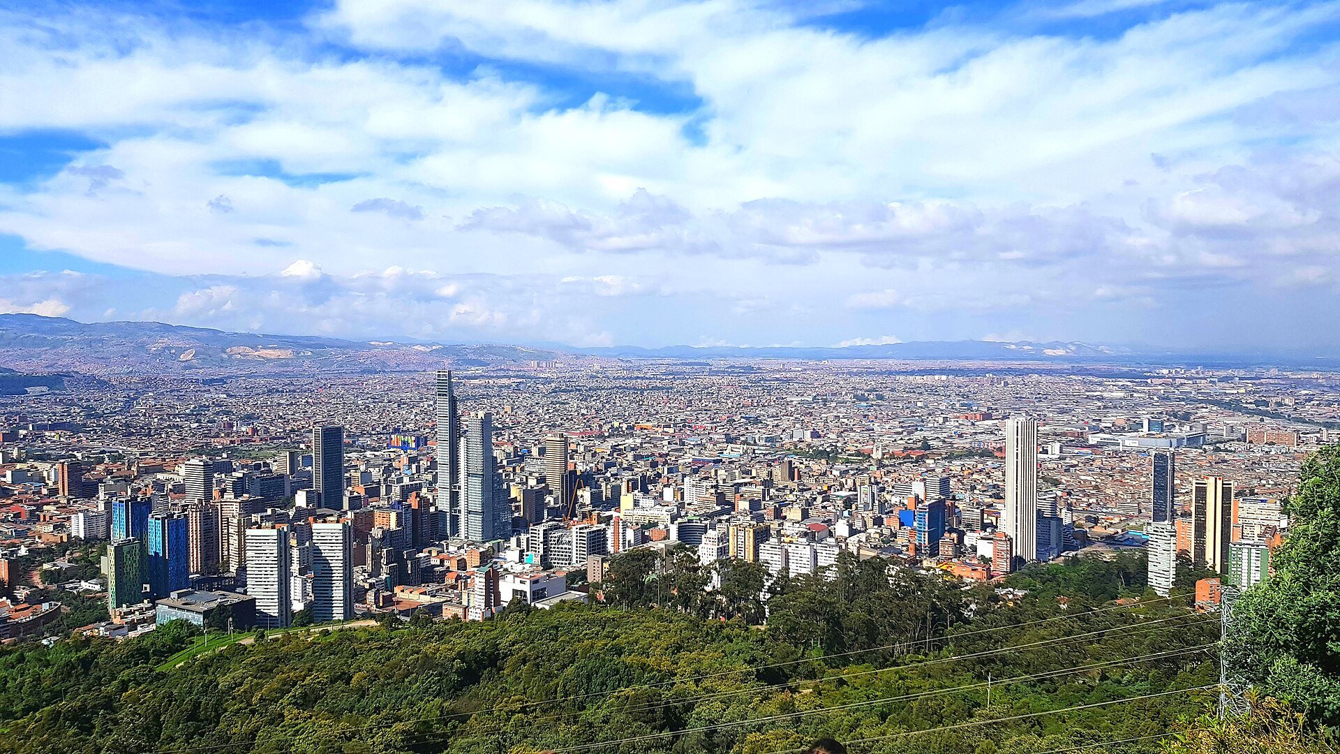 An elevated view of the Bogota skyline, illustrating the Colombia income tax deadline relief for six quake-hit departments.