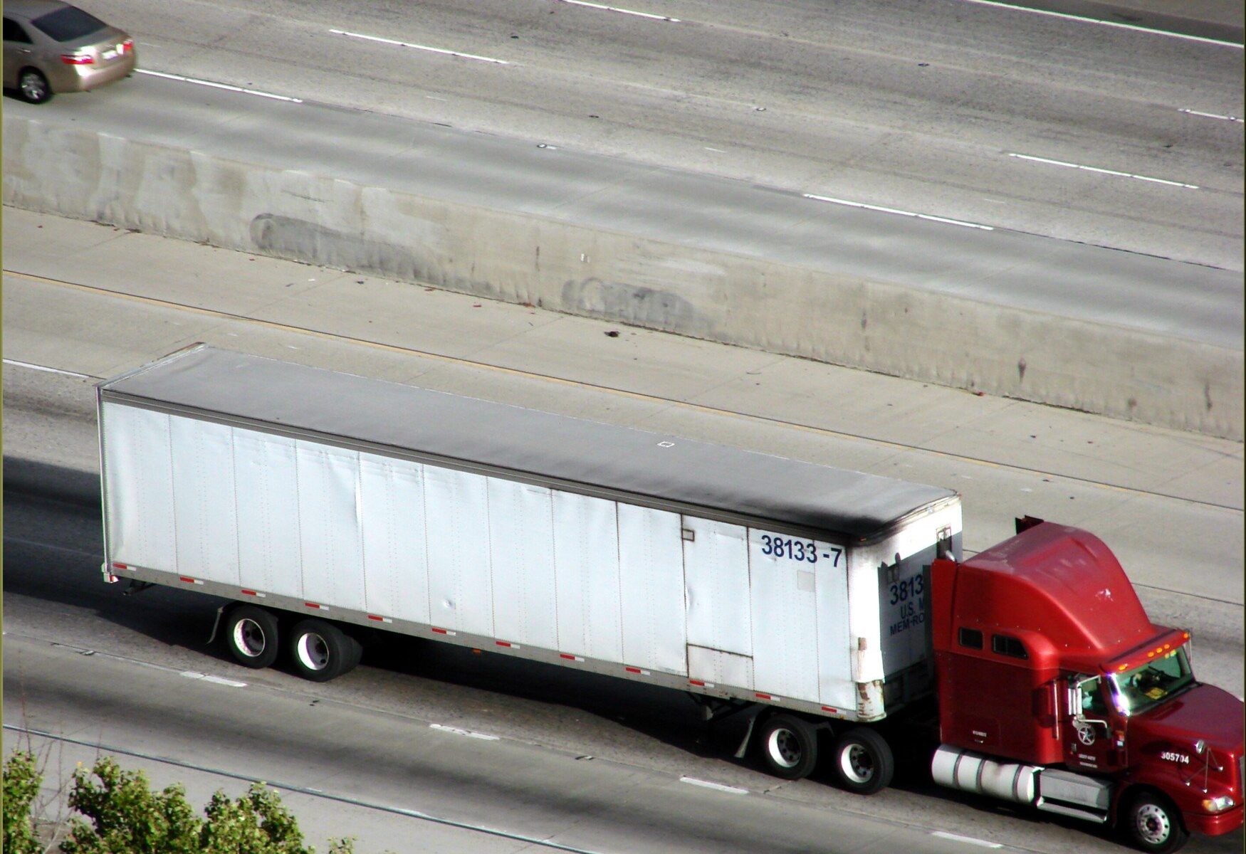 Freight trucks on a highway, illustrating why freight transport is treated as a high-risk activity