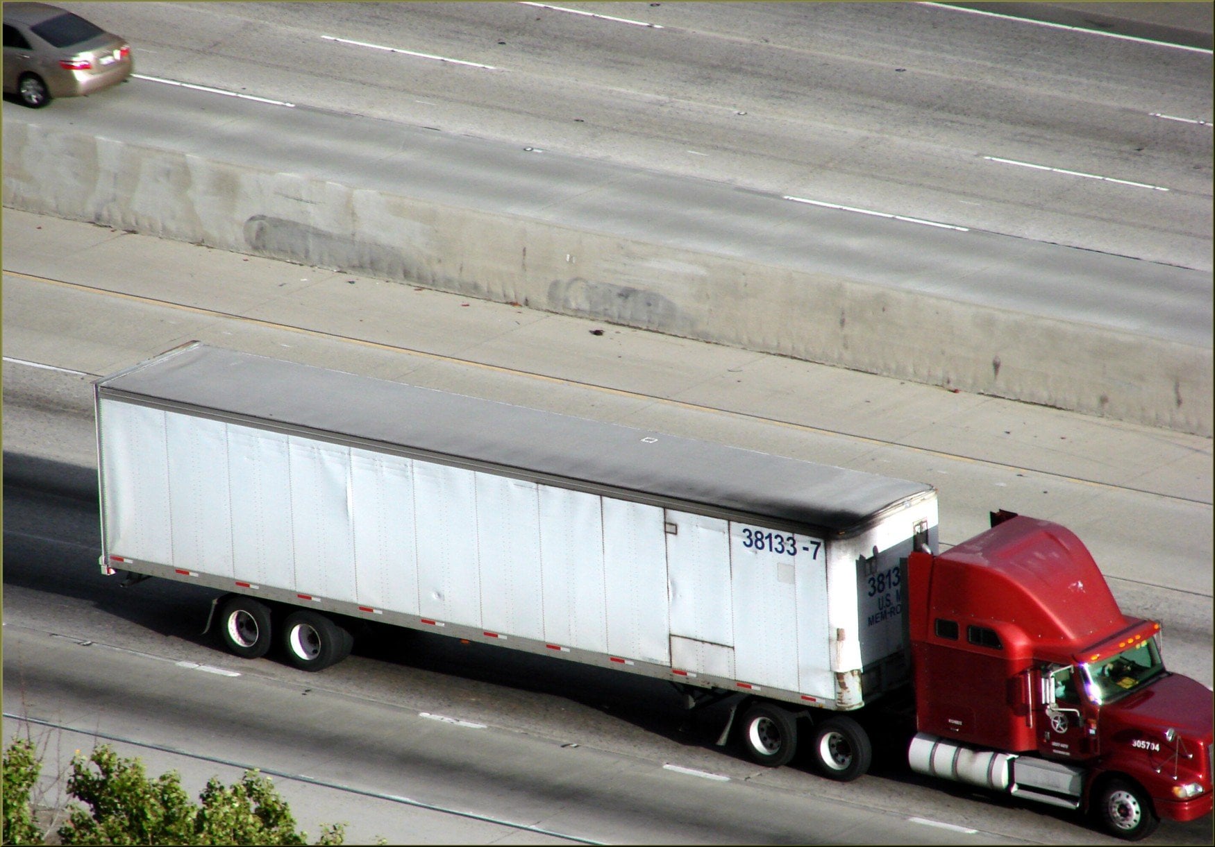 Freight trucks on a highway, illustrating why freight transport is treated as a high-risk activity