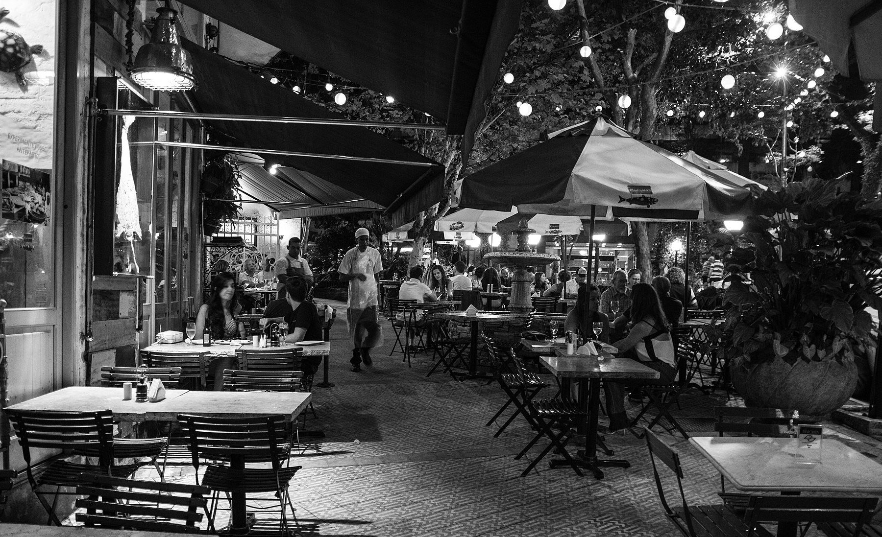 São Paulo restaurants - lit-up restaurant facades along a downtown dining street at night