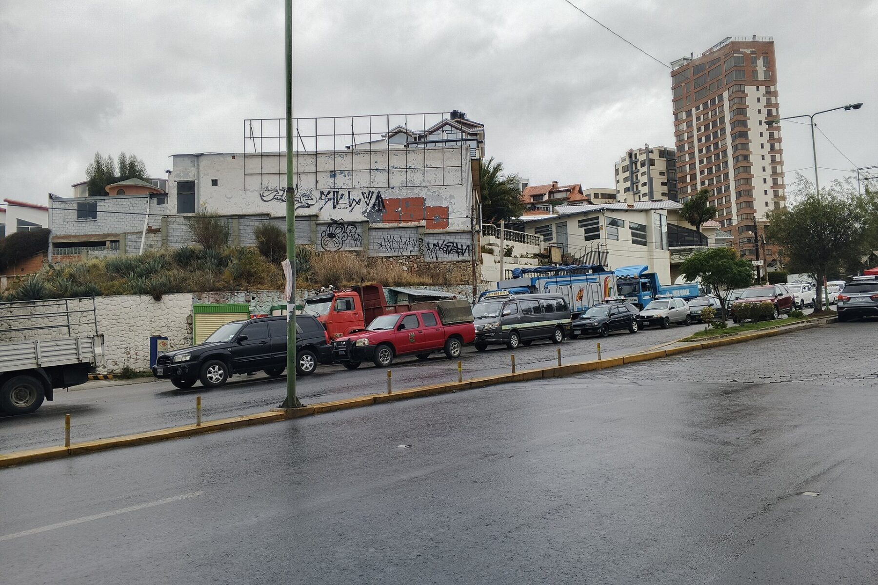 Bolivia diesel shortage - cars and trucks queue for fuel on a Bolivian street