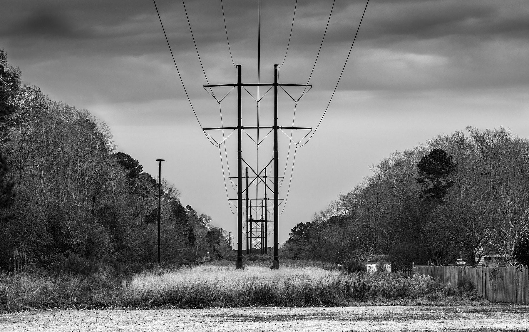 High-voltage power lines at dusk, illustrating Colombia's power and water recovery after the earthquake.