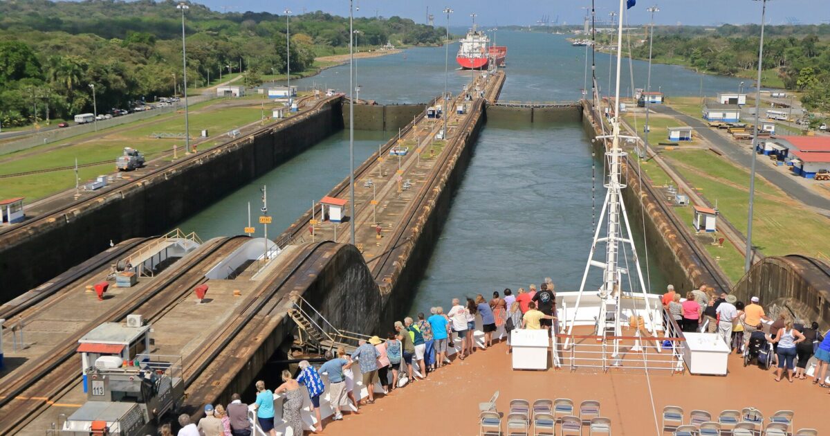 A ship transiting the Panama Canal locks, where traffic and cargo tonnage have risen as draft depth recovered from drought
