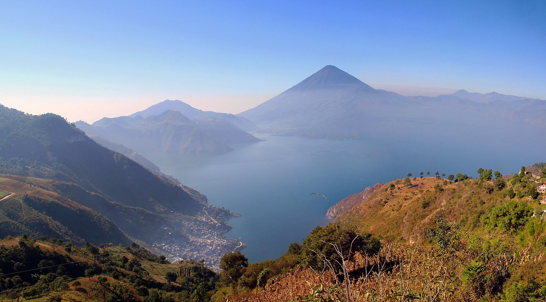Guatemala tourism - panorama of Lake Atitlan with volcanoes