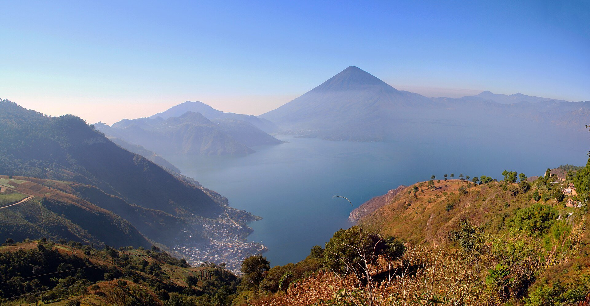 Guatemala tourism - panorama of Lake Atitlan with volcanoes