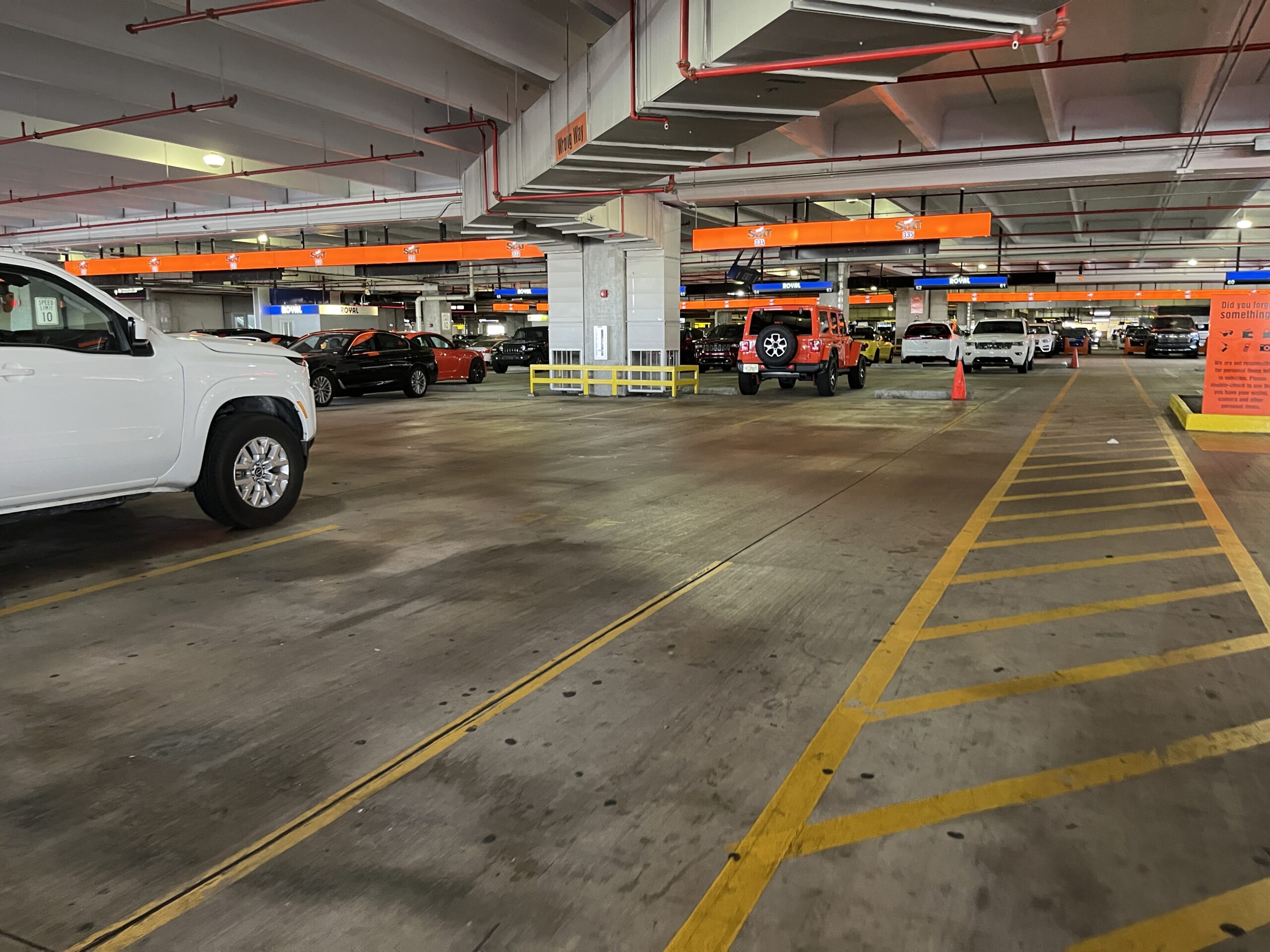 Movida car rental fleet vehicles parked in rows, illustrating Movida Q2 net income results