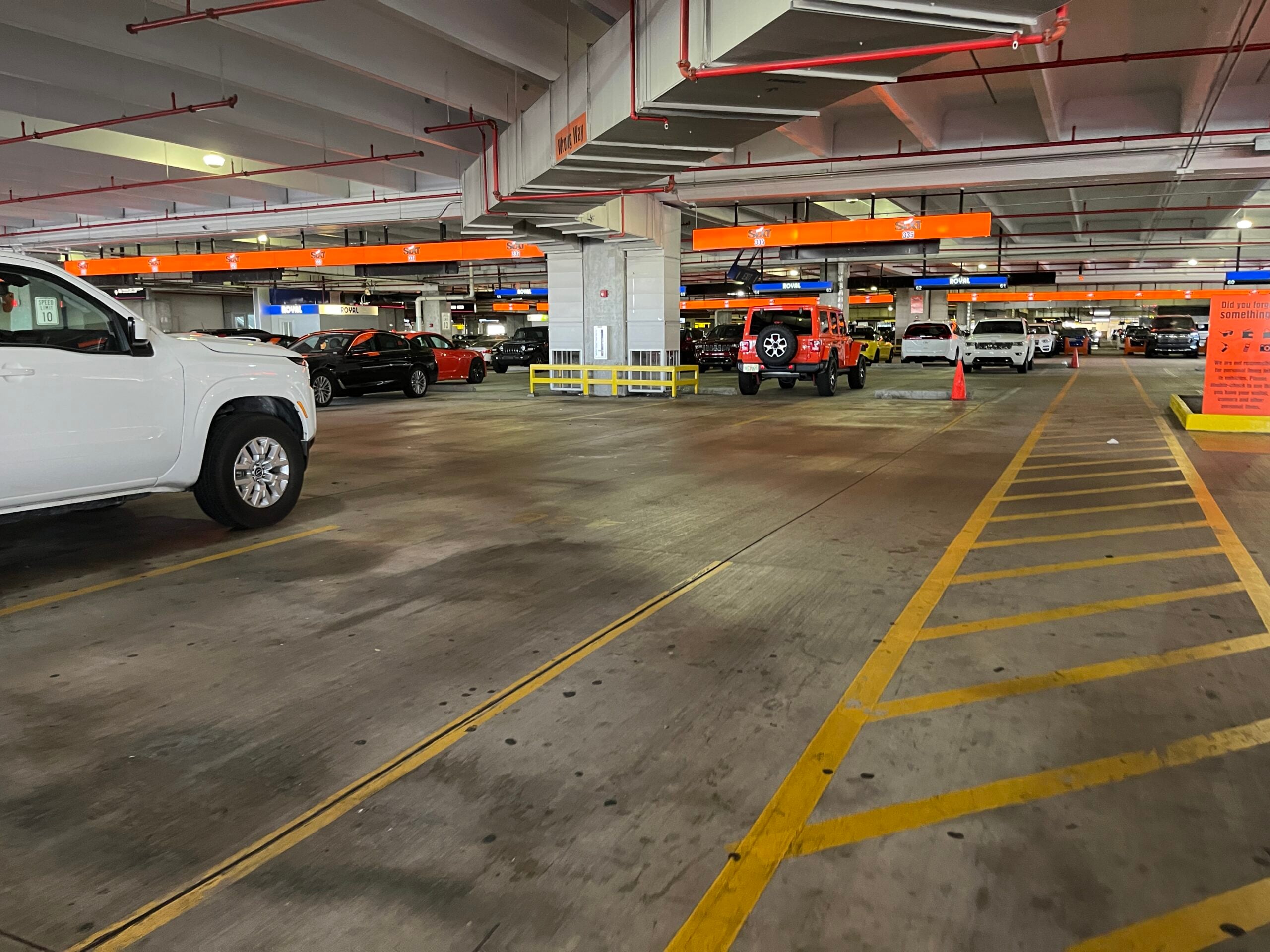 Movida car rental fleet vehicles parked in rows, illustrating Movida Q2 net income results