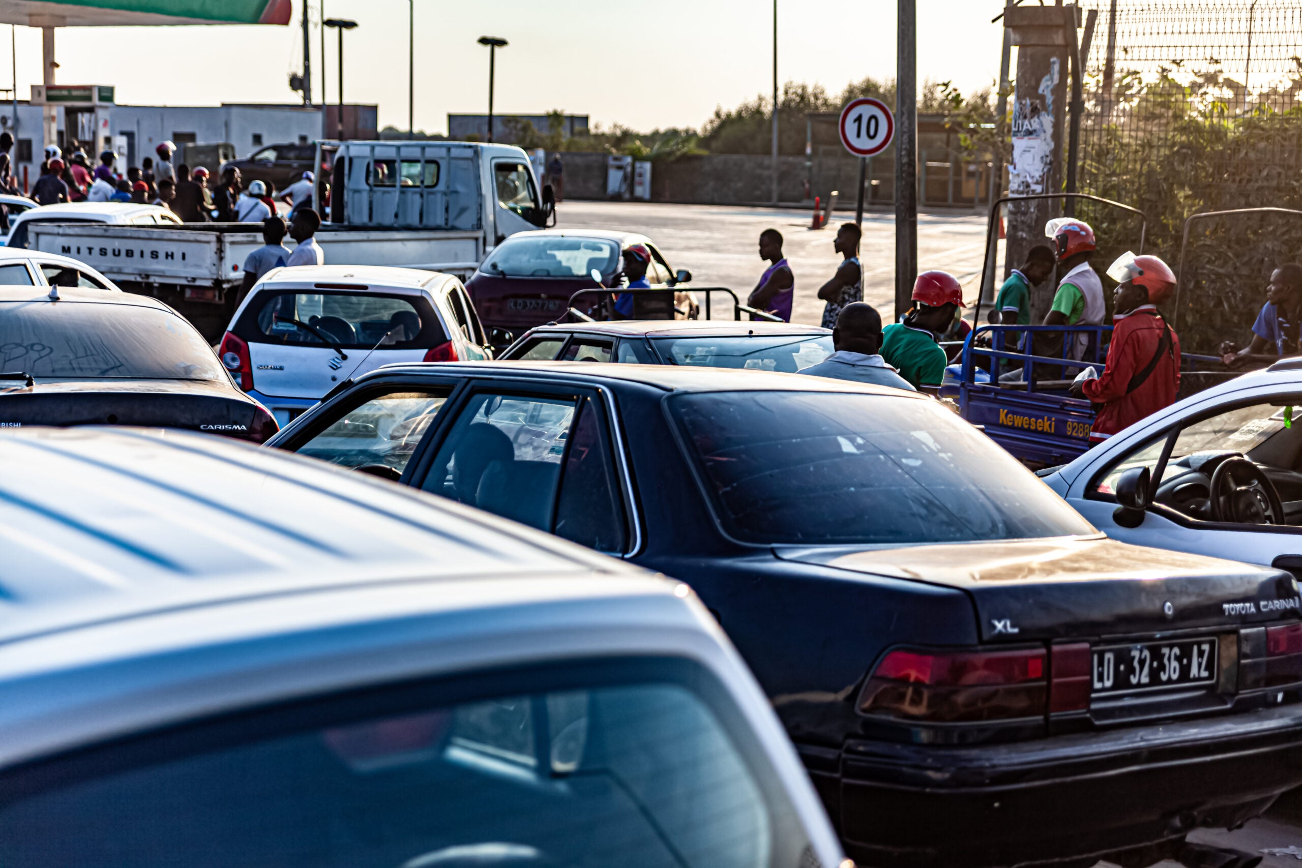 Angola fuel import bill - cars queuing at a service station in Angola