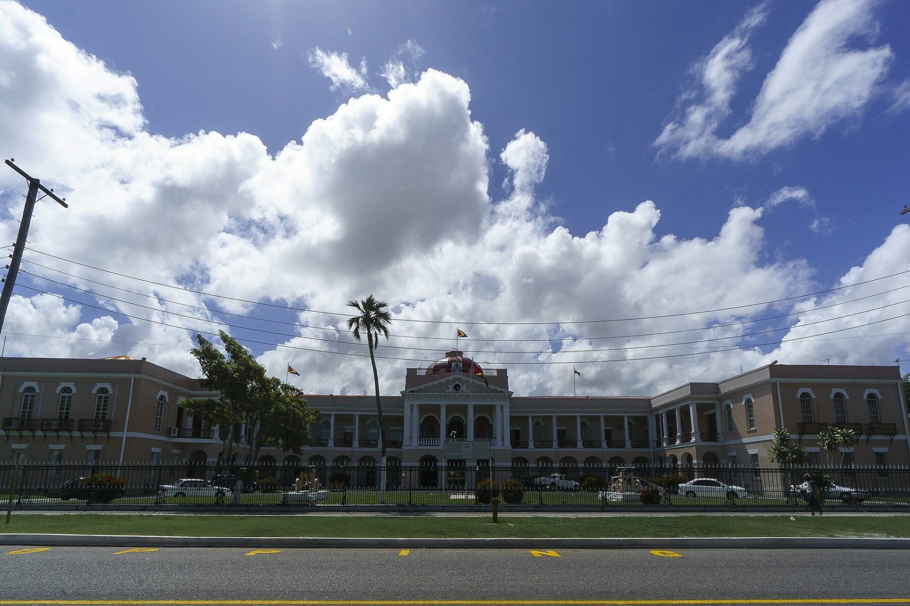 The Parliament Building in Georgetown, Guyana, a domed colonial-era building flying Guyanese flags